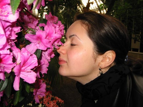 anastasia smelling flowers