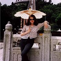 Anastasia at the bottom of stairs to Buddah
