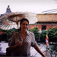 Anastasia with umbrella at Po Lin Monastery