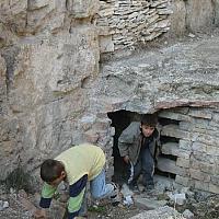 local boys play in the ruins