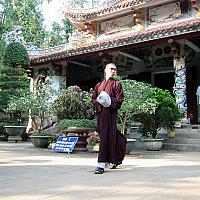 monk near pagoda on marble mountain
